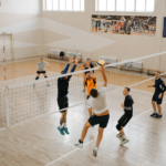 Male group of students playing volleyball